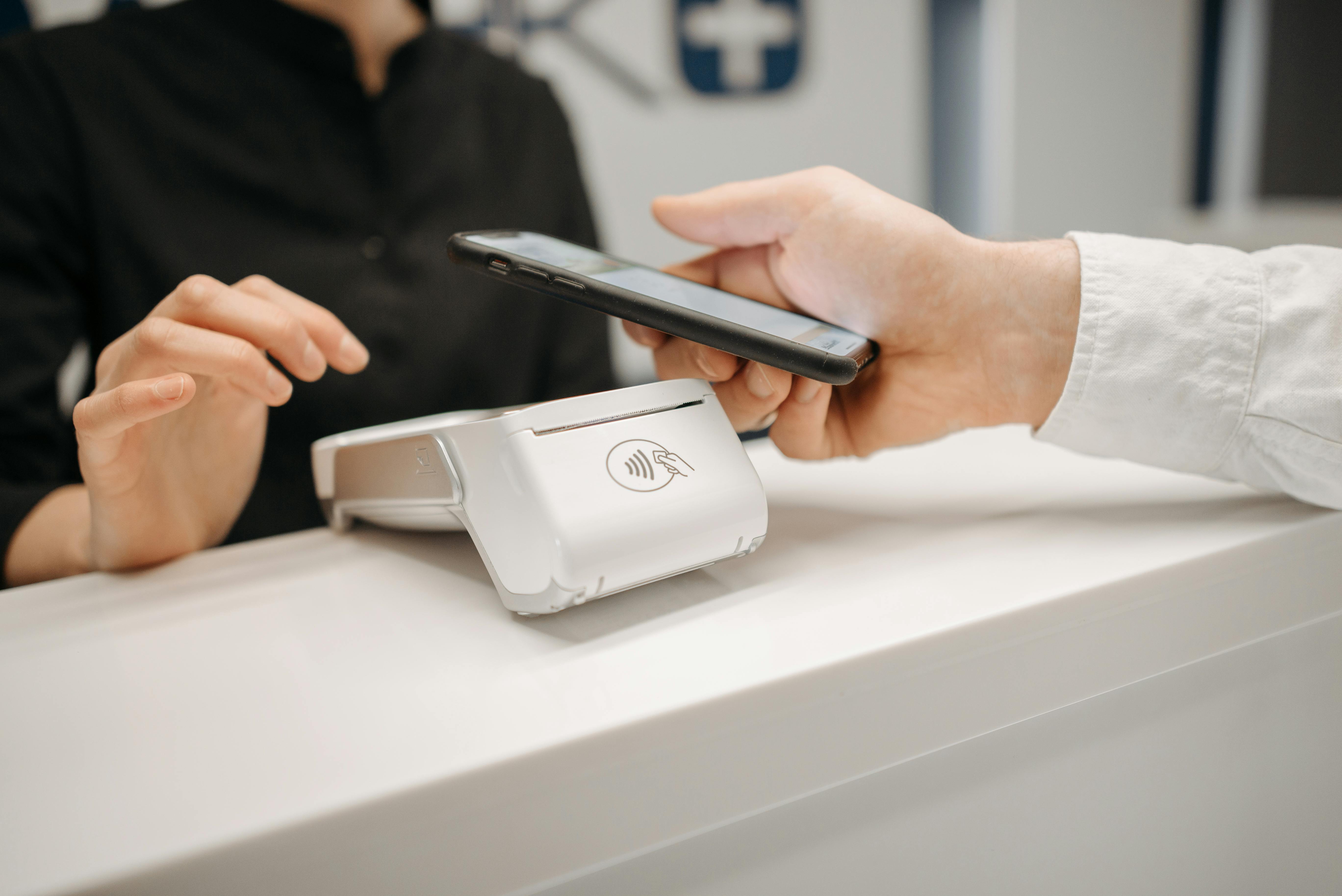 Customer tapping a payment terminal
